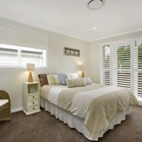 White blinds in a rustic bedroom