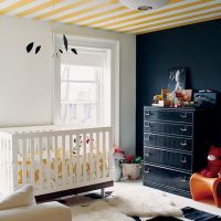 Striped ceiling in the room for the newborn