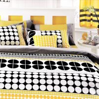 Bright textiles on the bed of young spouses