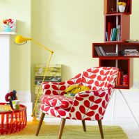 Red and white armchair on wooden legs
