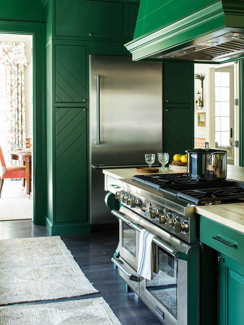 Stylish kitchen in emerald shade