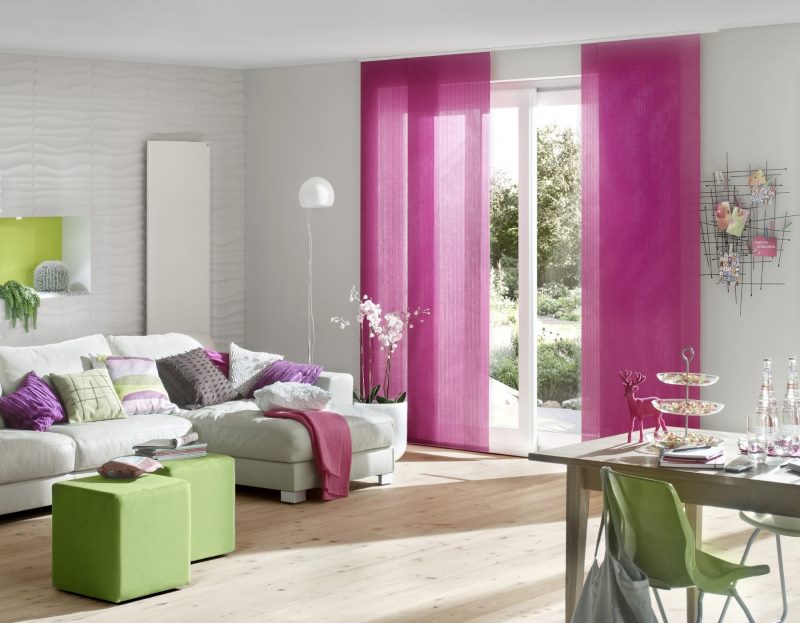 Raspberry blinds in the interior of a bright living room