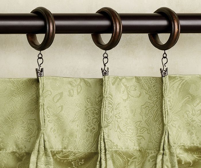Securing curtains with clips and rings