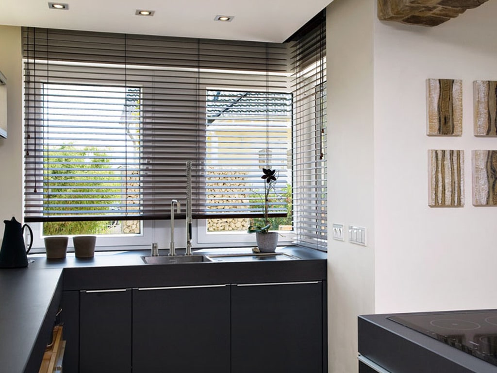 Modern kitchen with plastic blinds
