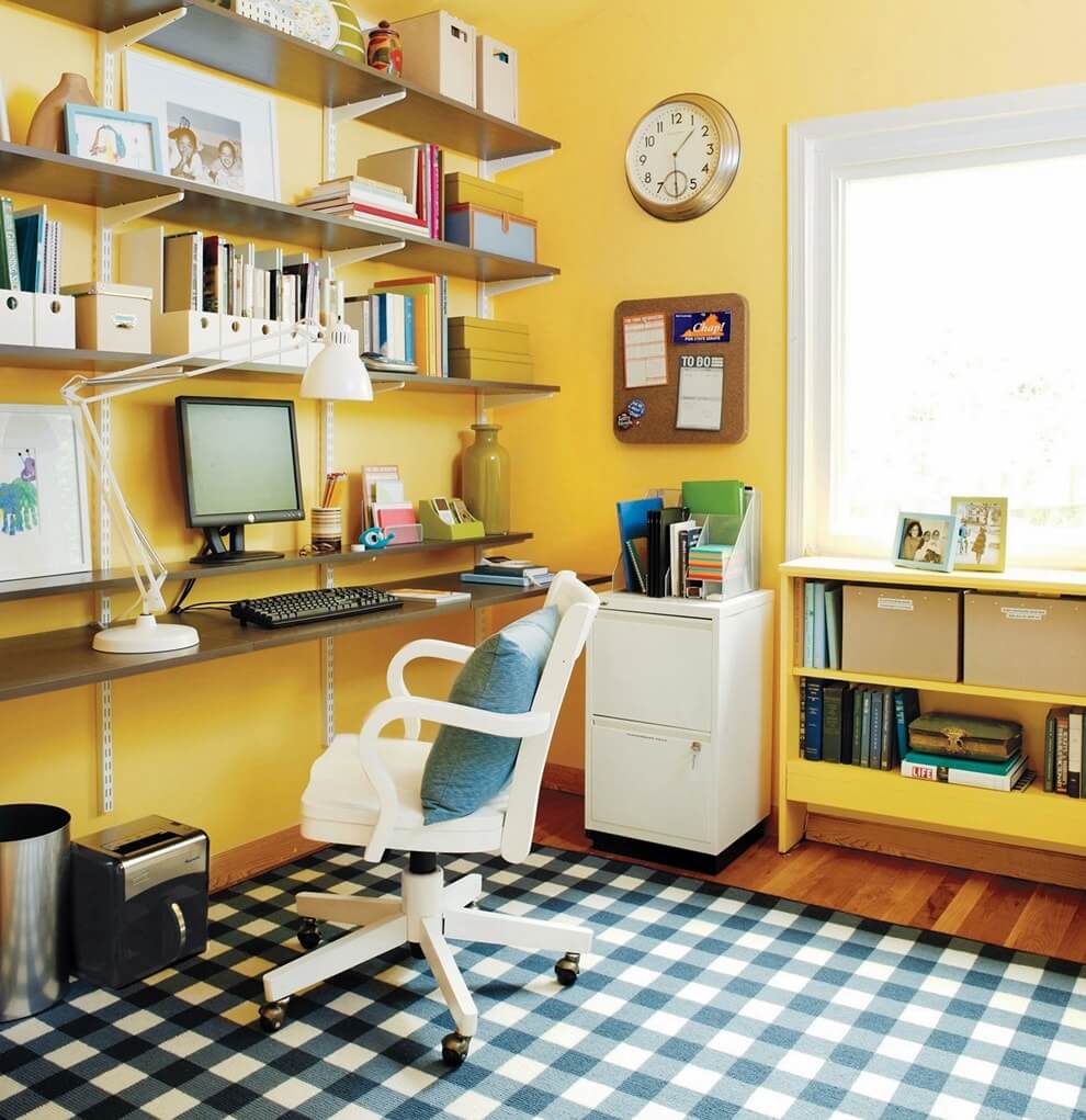 The interior of the home office with yellow walls