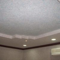 Two-level plasterboard ceiling with spotlights