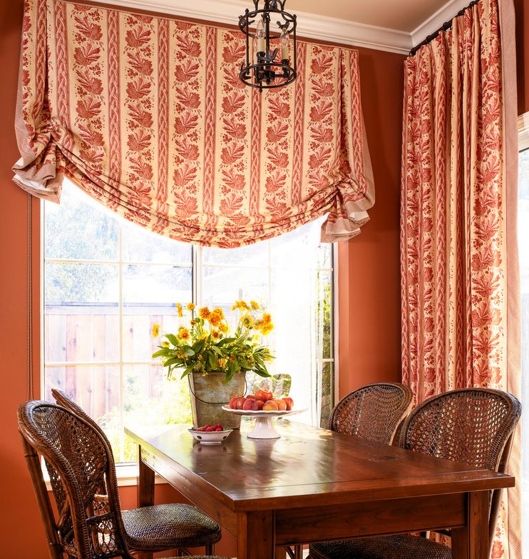 The combination of London and ordinary curtains on the windows of the living room