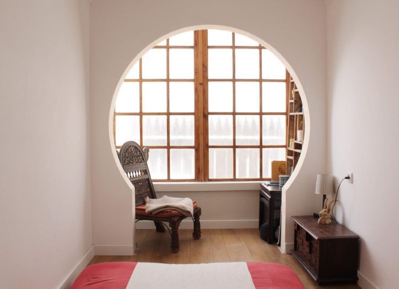 Window in the bedroom with a wooden frame
