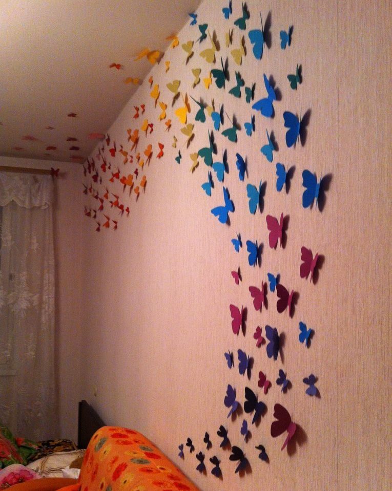 Paper butterflies on a living room wall