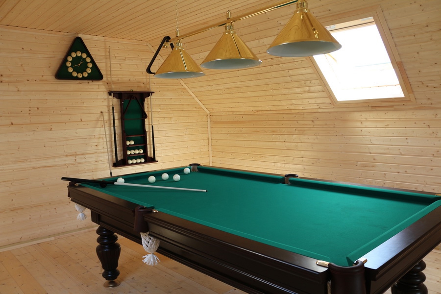 Billiard table with green cloth