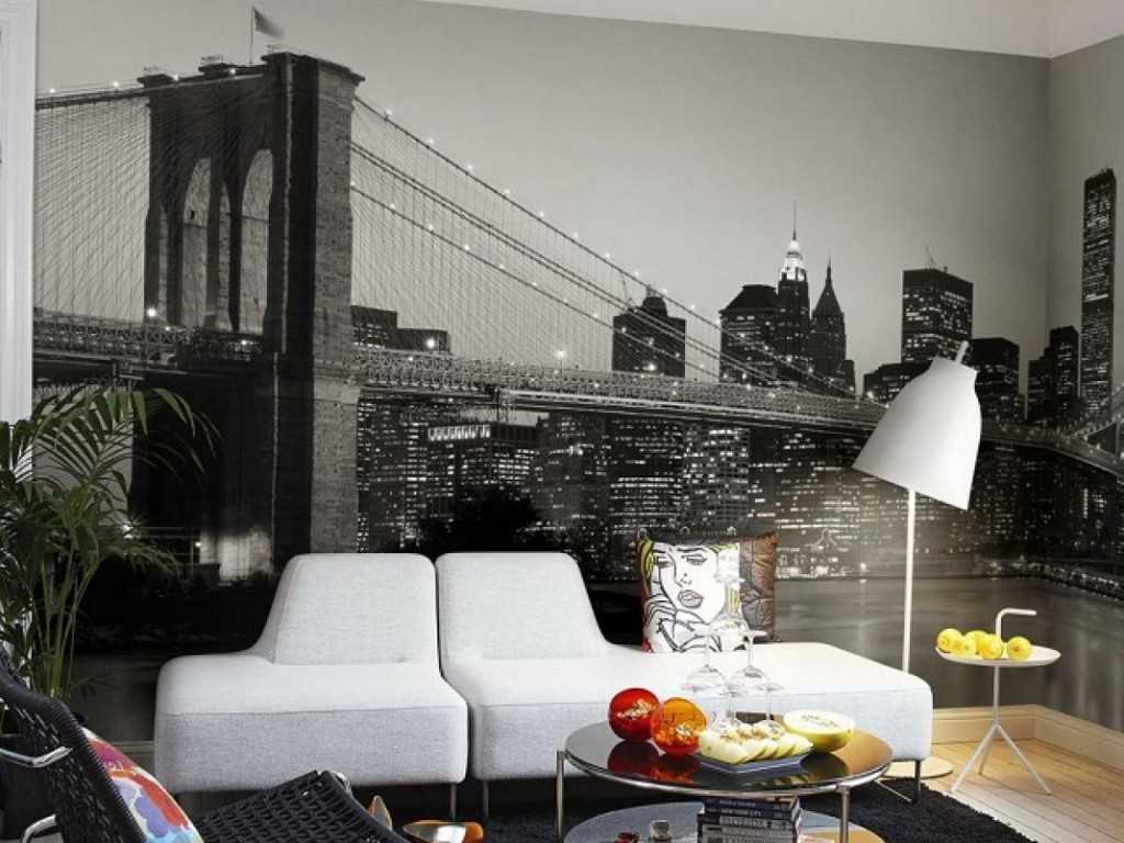 The image of the bridge in the night city on the wallpaper in the living room