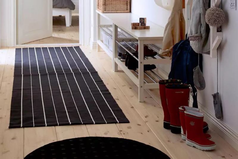 Black rug with narrow white stripes