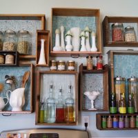 Spices on wooden kitchen shelves