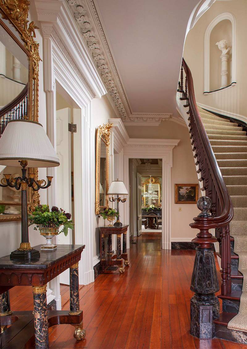 Lacquered floor in a classic hall with stairs