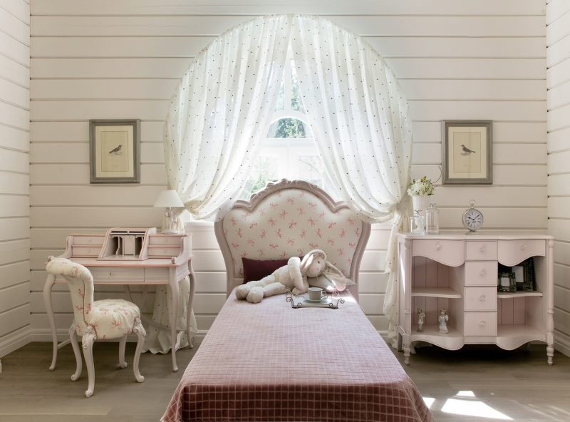 Baby bed with soft headboard