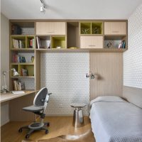 The interior of a small children's room with open shelving