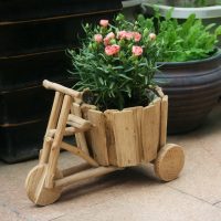 Vase for flowers in the form of a scooter