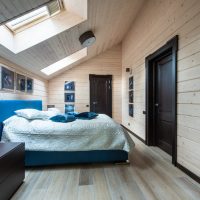 Blue bed in the attic bedroom
