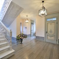 Gray laminate floor in the hallway of a private house