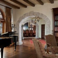Black piano in the living room of a country house