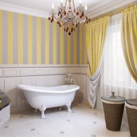 Striped wallpaper in the design of the bathroom