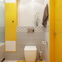 Yellow accents in a modern toilet