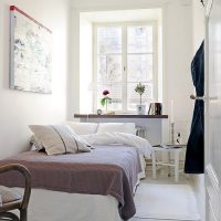Gray bedspread on a white bed