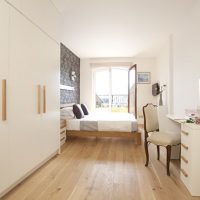 White bedroom with window at the end