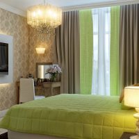 The combination of green curtains with a bedspread on the bed