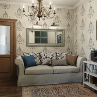 Mirror in a gray frame over the sofa