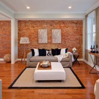Brick wall in an industrial style living room interior