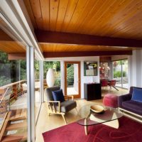 Wooden ceiling in a room with panoramic windows