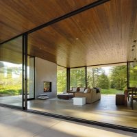 Glass walls of a spacious living room