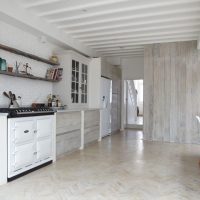 Open shelves from boards in a Scandinavian style kitchen