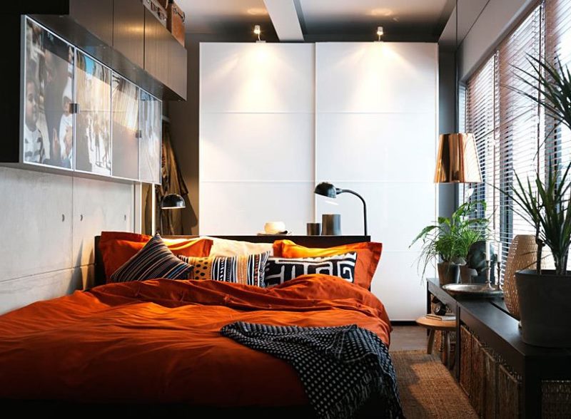 Wall cabinets over the bed in the narrow bedroom