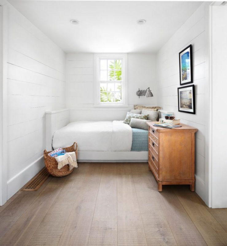 Brown floor in a white bedroom of a private house