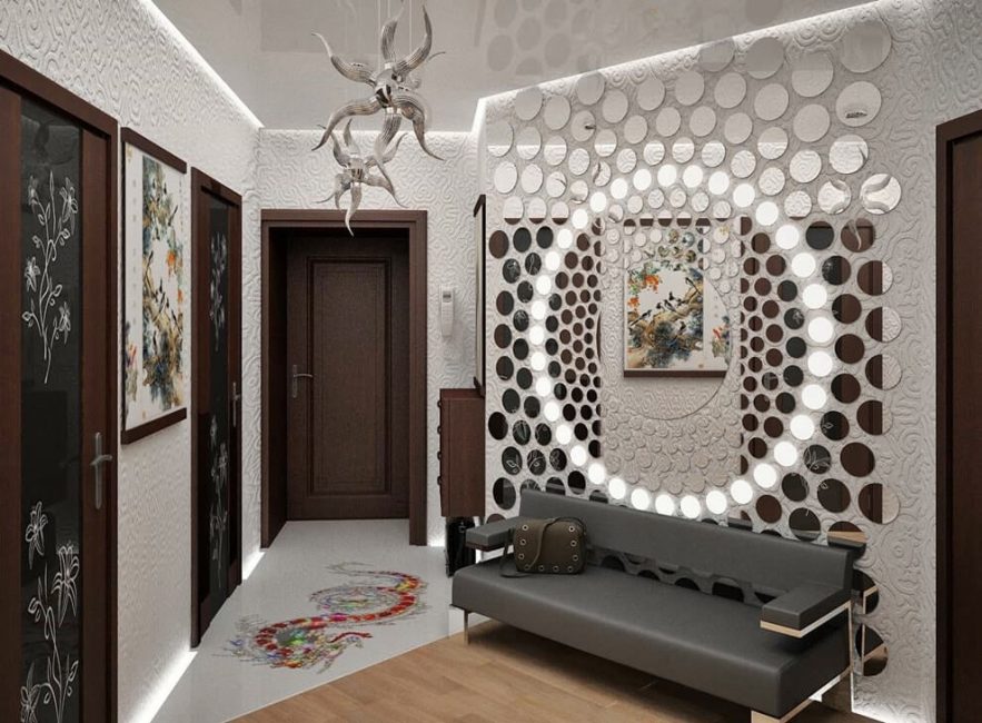 Round mirror tiles over the sofa in the hallway