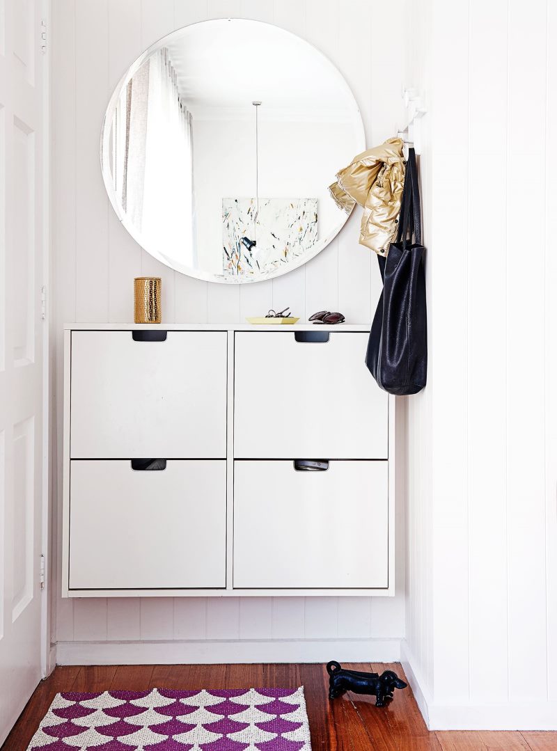 Hanging cabinet with four drawers in a narrow hallway