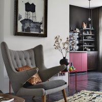 Gray armchair with unusual armrests
