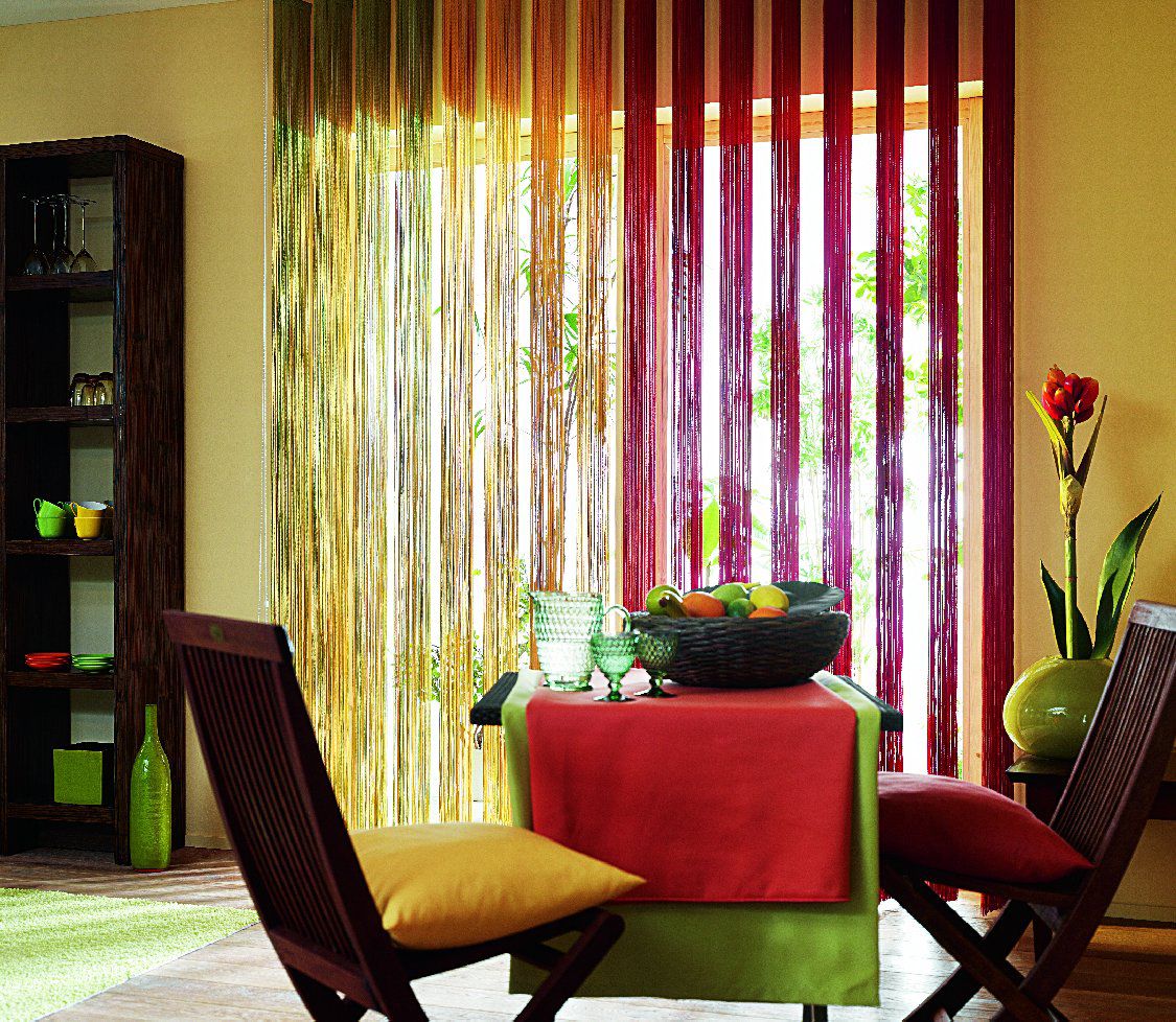 Multi-colored filament curtains in the interior of a modern kitchen