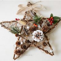 Star made of wooden sticks and fir cones
