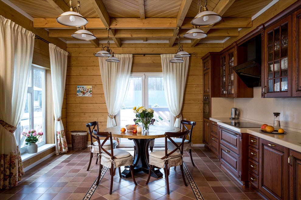 Dining area with a round table in the kitchen of a country house