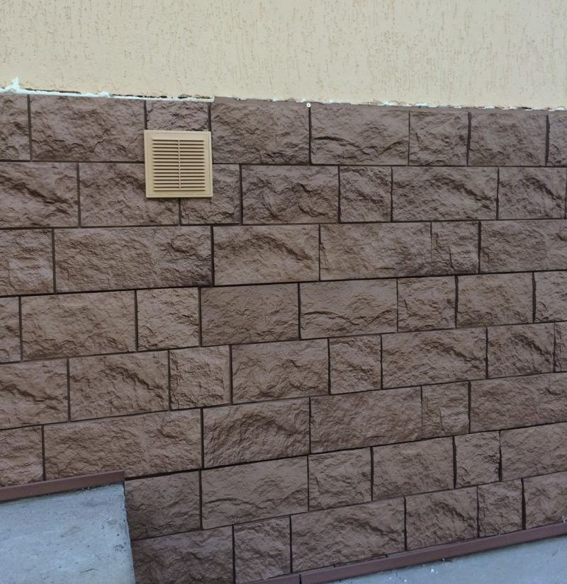 Finishing with artificial stone in the basement of a residential building