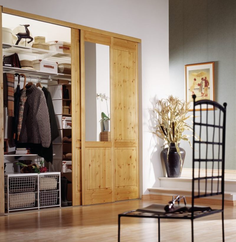 Sliding wardrobe with an open wooden door