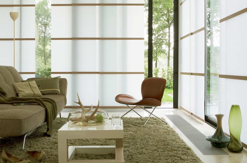 Living room windows with panel curtains