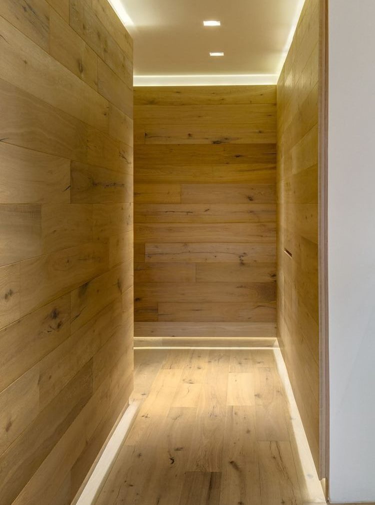 Wooden walls of an elongated corridor