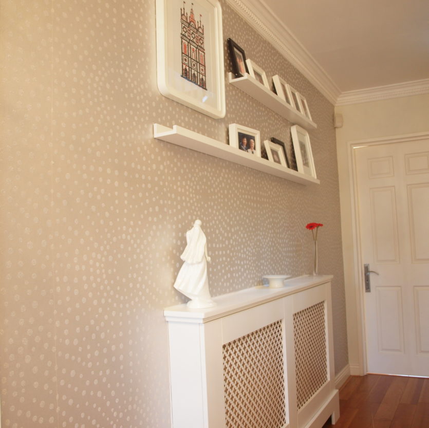 Shelves with decorations on the hallway wall