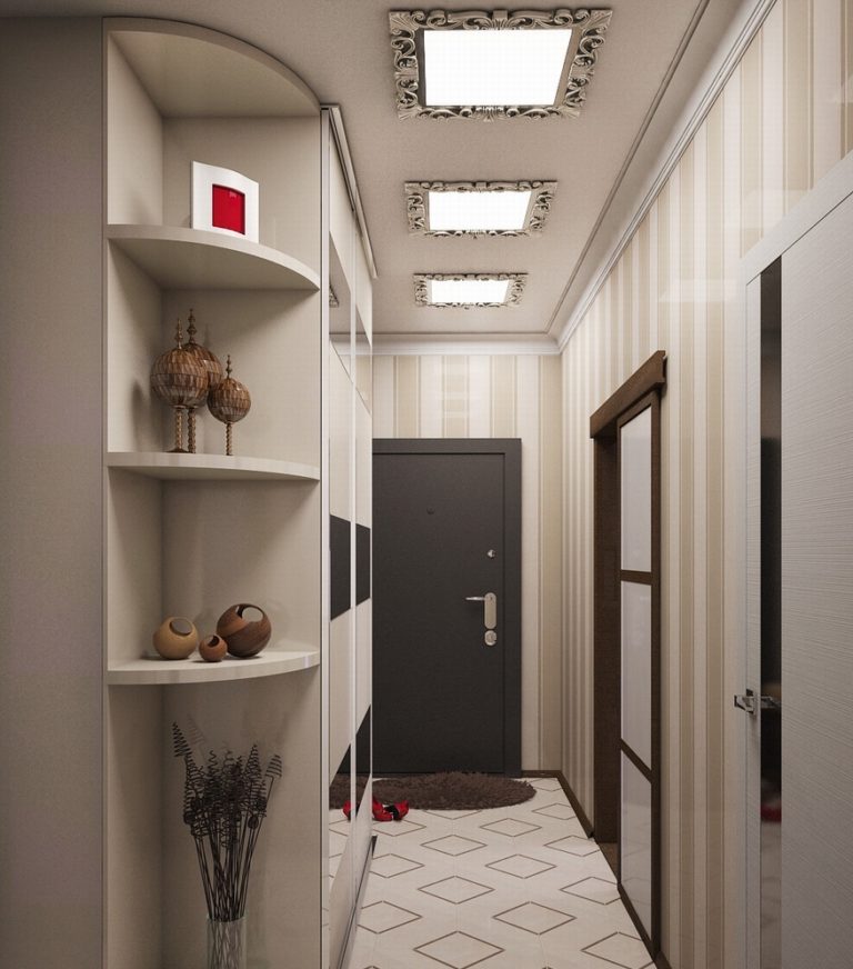 Three recessed lights on the ceiling of a narrow hallway