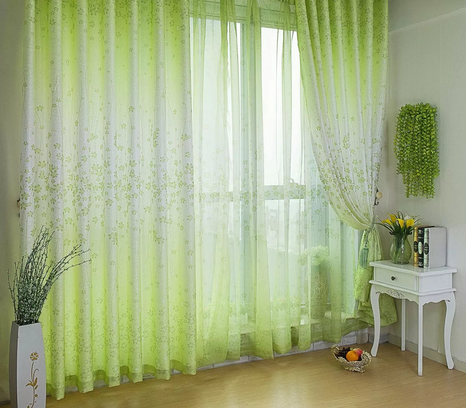 Living room window with greenish sheer curtains