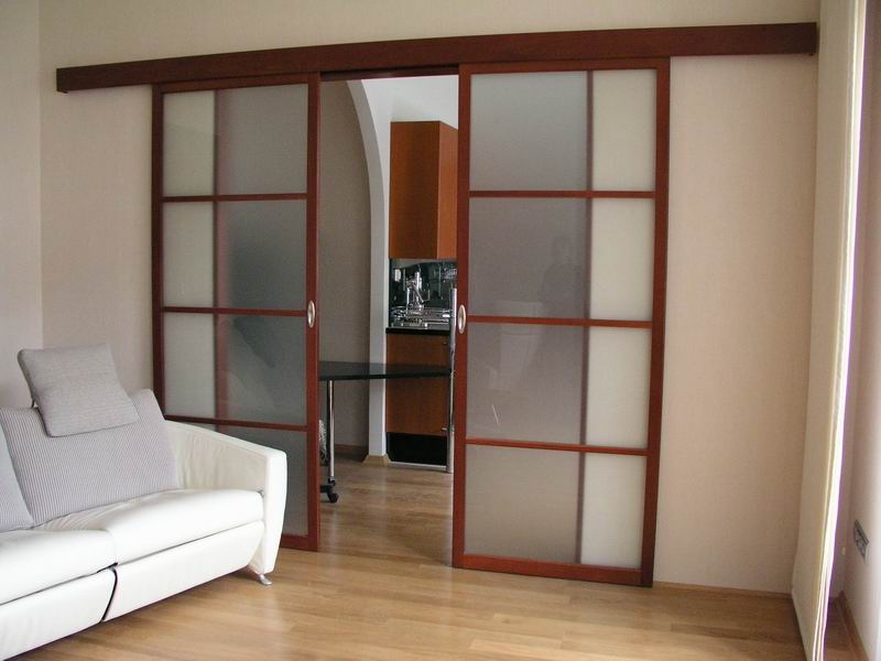 Sliding doors on a wooden frame with glass